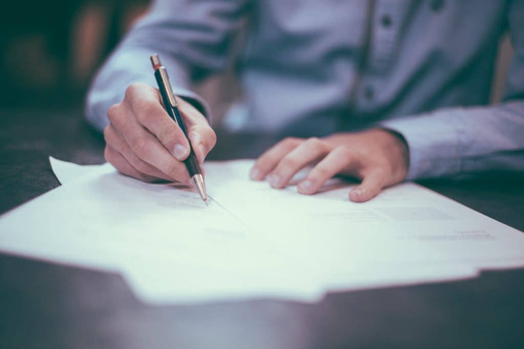 Man writing important fire safety documents