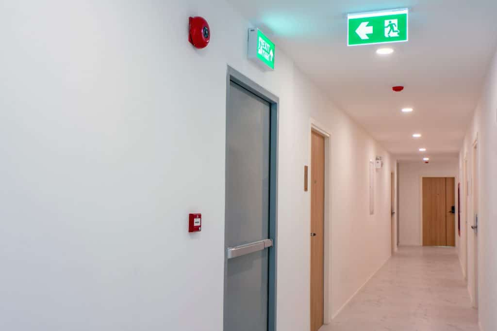 a corridor fitted with fire stopping services by element pfp