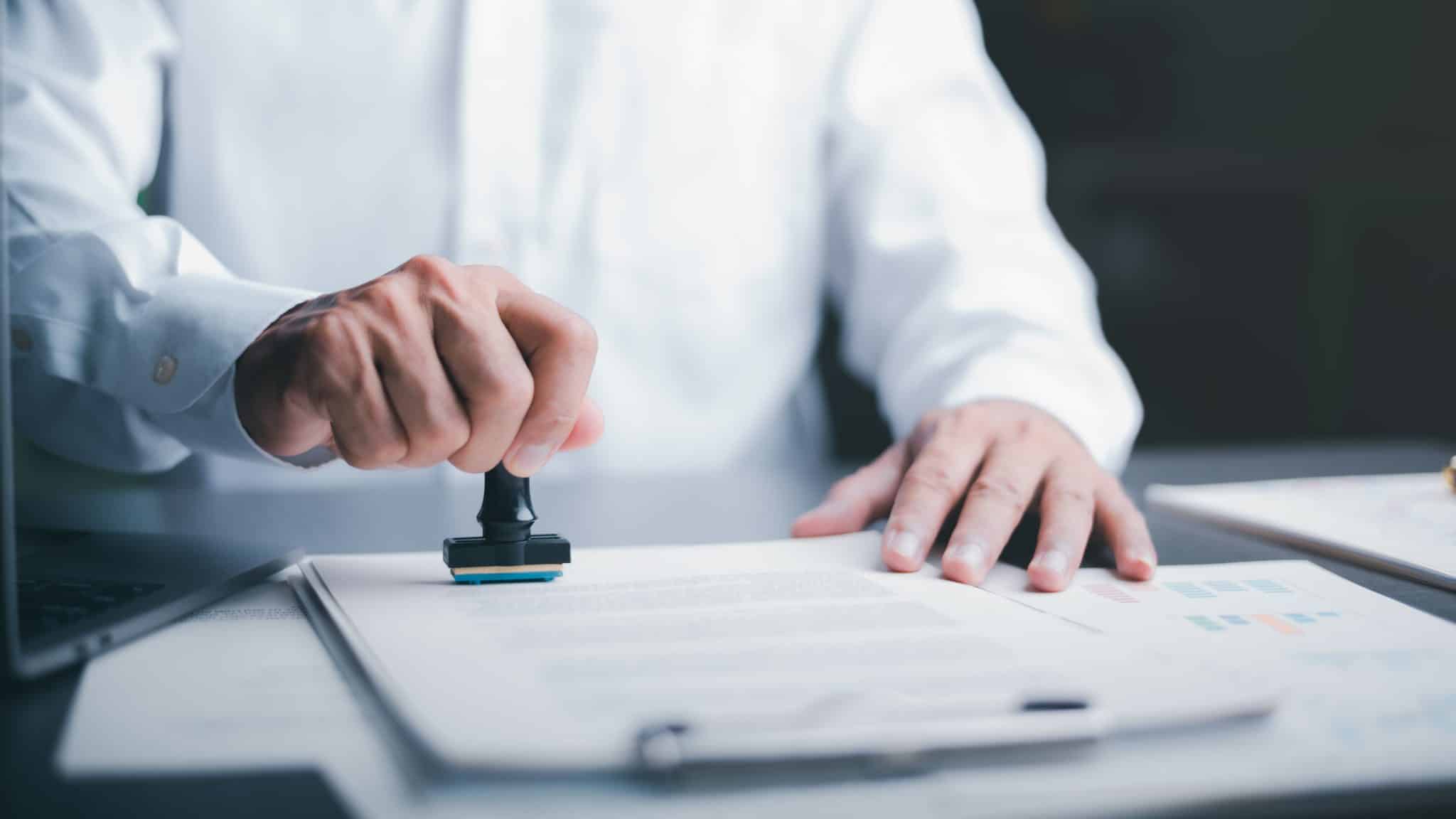 Businessman,Validates,And,Manages,Business,Documents,And,Agreements,,Signing,A