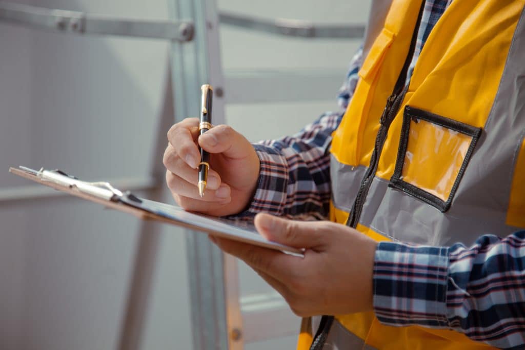 Element PHP team member filling out fire compartmentation checklist