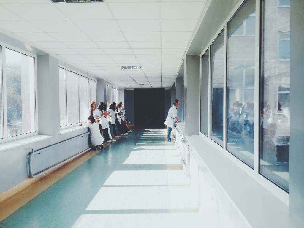 Bright hospital hallway with viewing window