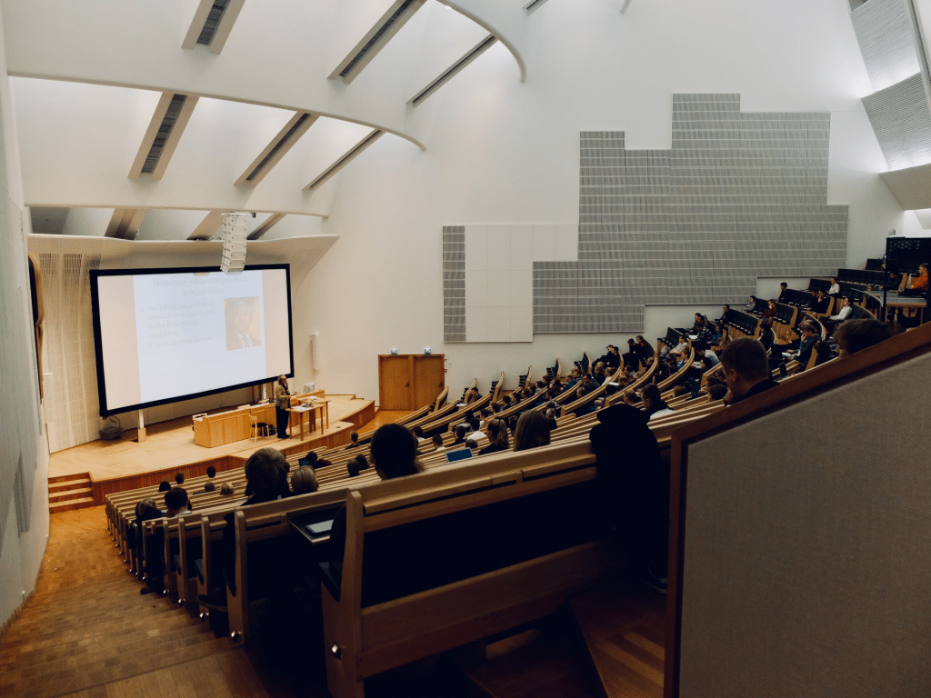 University lecture hall with students observing a presentation
