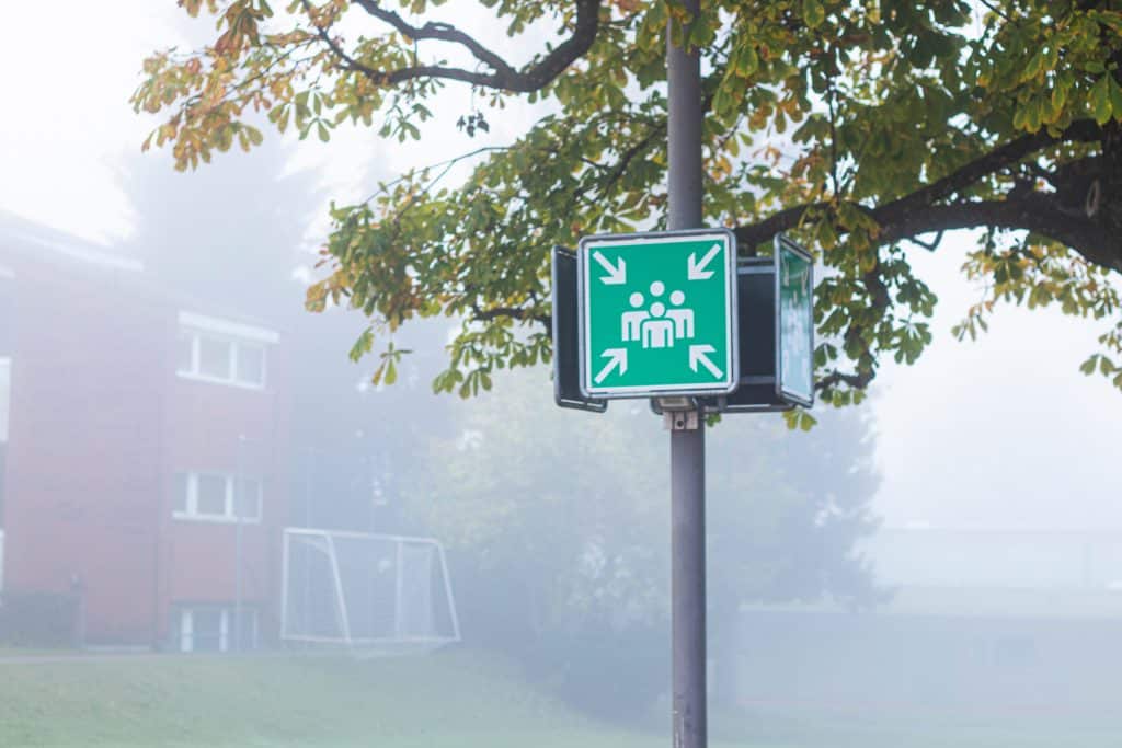 Fire evacuation meeting point sign